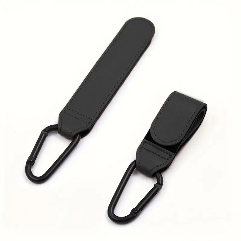 XOLY Stroller Hook Clips – 2 Pcs Heavy-Duty Non-Slip Pram Bag Holders (Black).